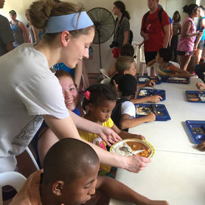 Anna Holder serving at the Nutrition Center